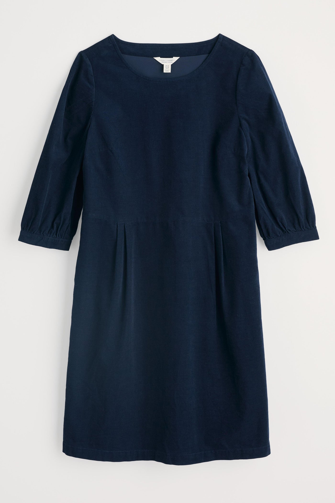 Navy blue dress with puff sleeves on a light gray background