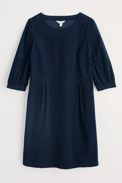 Navy blue dress with puff sleeves on a light gray background