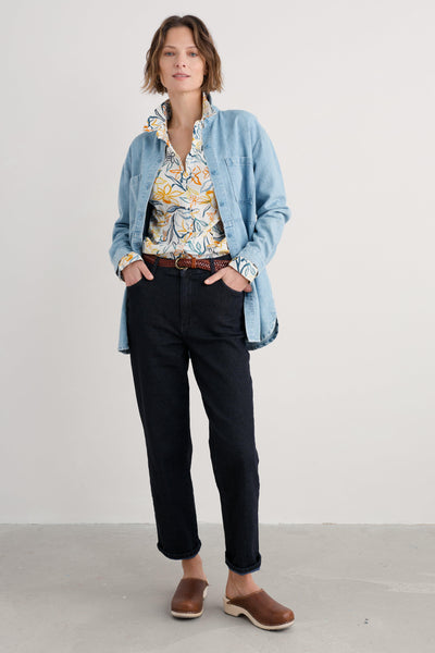  Model styled in the Larissa Shirt paired with casual trousers and denim jacket.