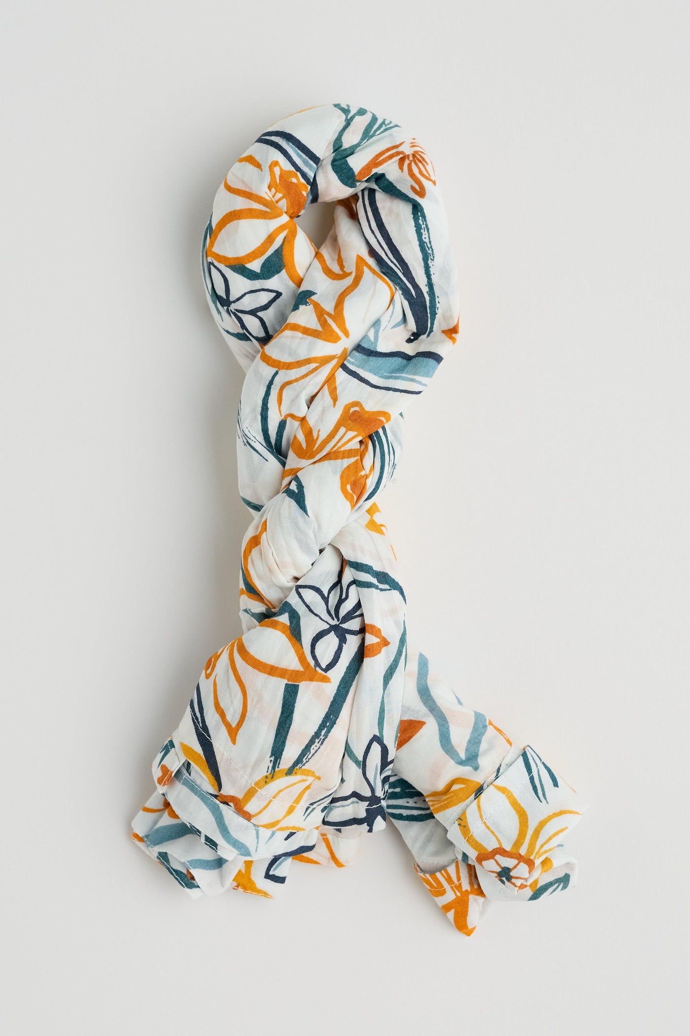 Larissa shirt twisted showing how it gets its crinkle texture.