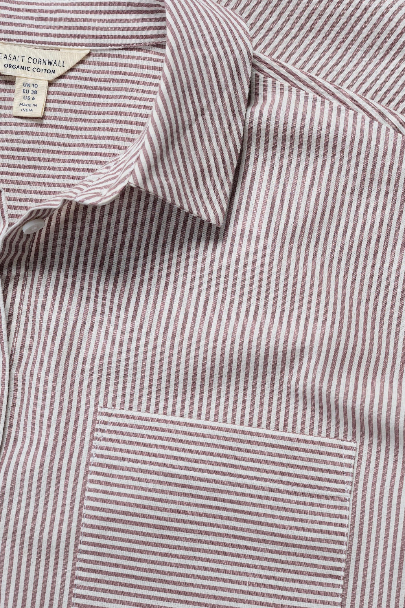 Close-up of a striped shirt with a visible Seasalt label 