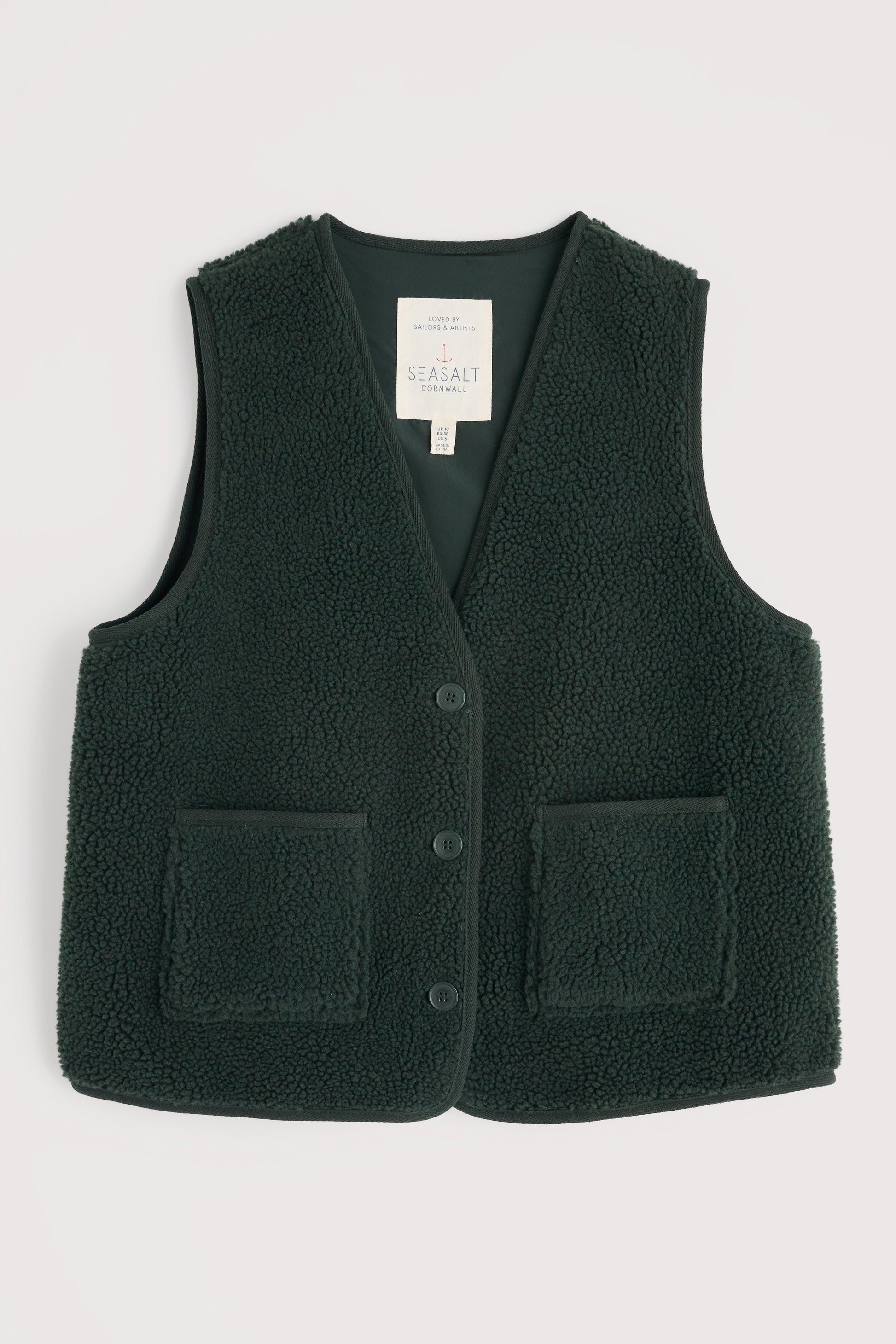 Dark green fleece vest with button details and pockets on a light gray background