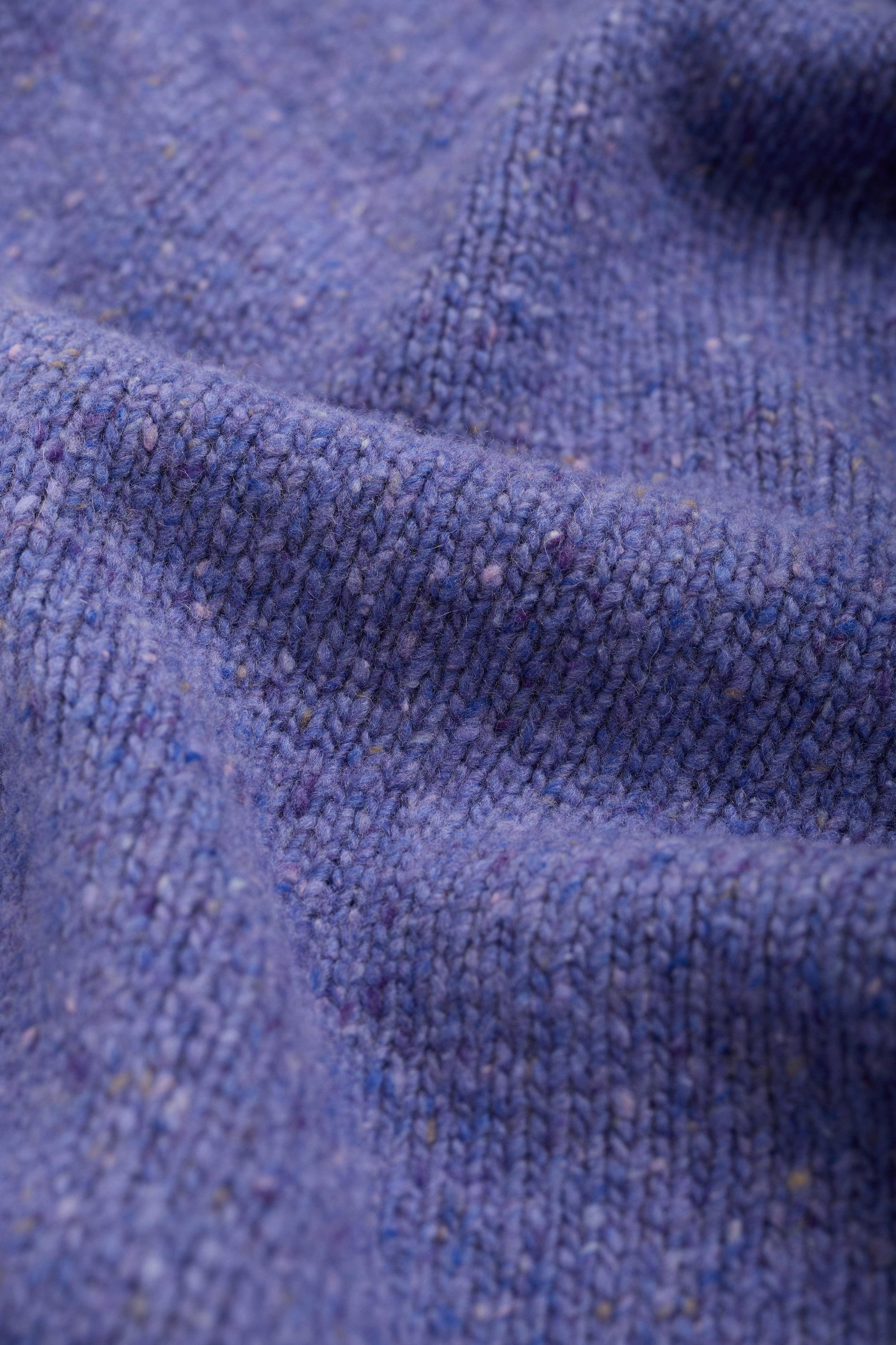 Close-up of purple wool fabric texture
