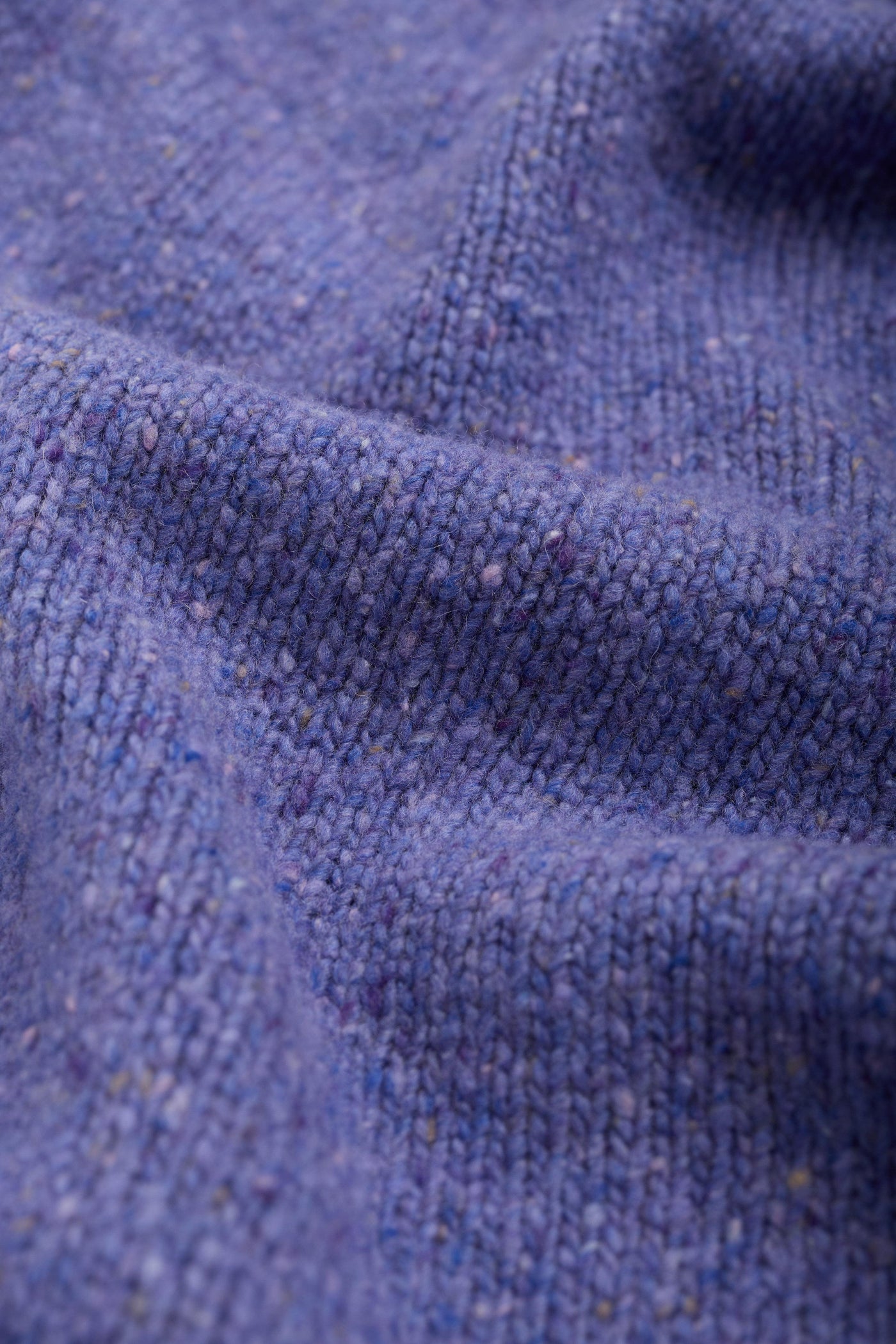 Close-up of purple wool fabric texture