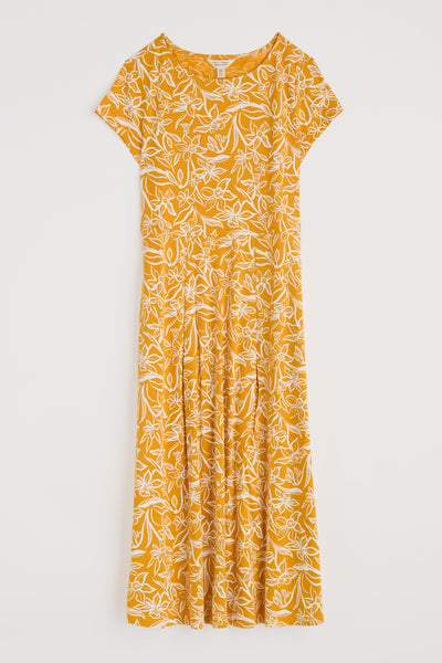 Flat lay of the Wild Bouquet Dress in Painted Daffodil Turmeric, showing shape and pattern clearly.