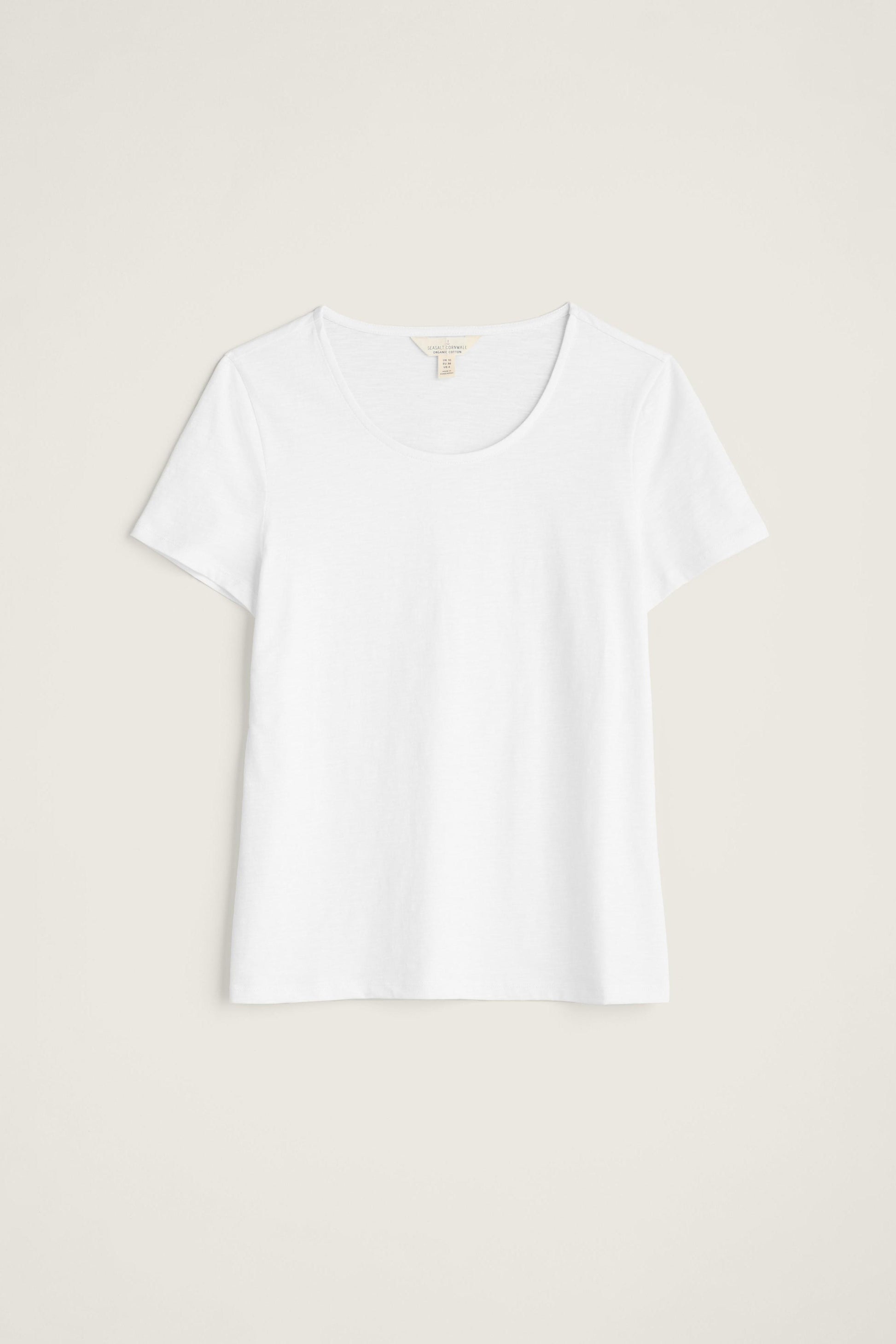 White organic cotton t-shirt on a light beige background