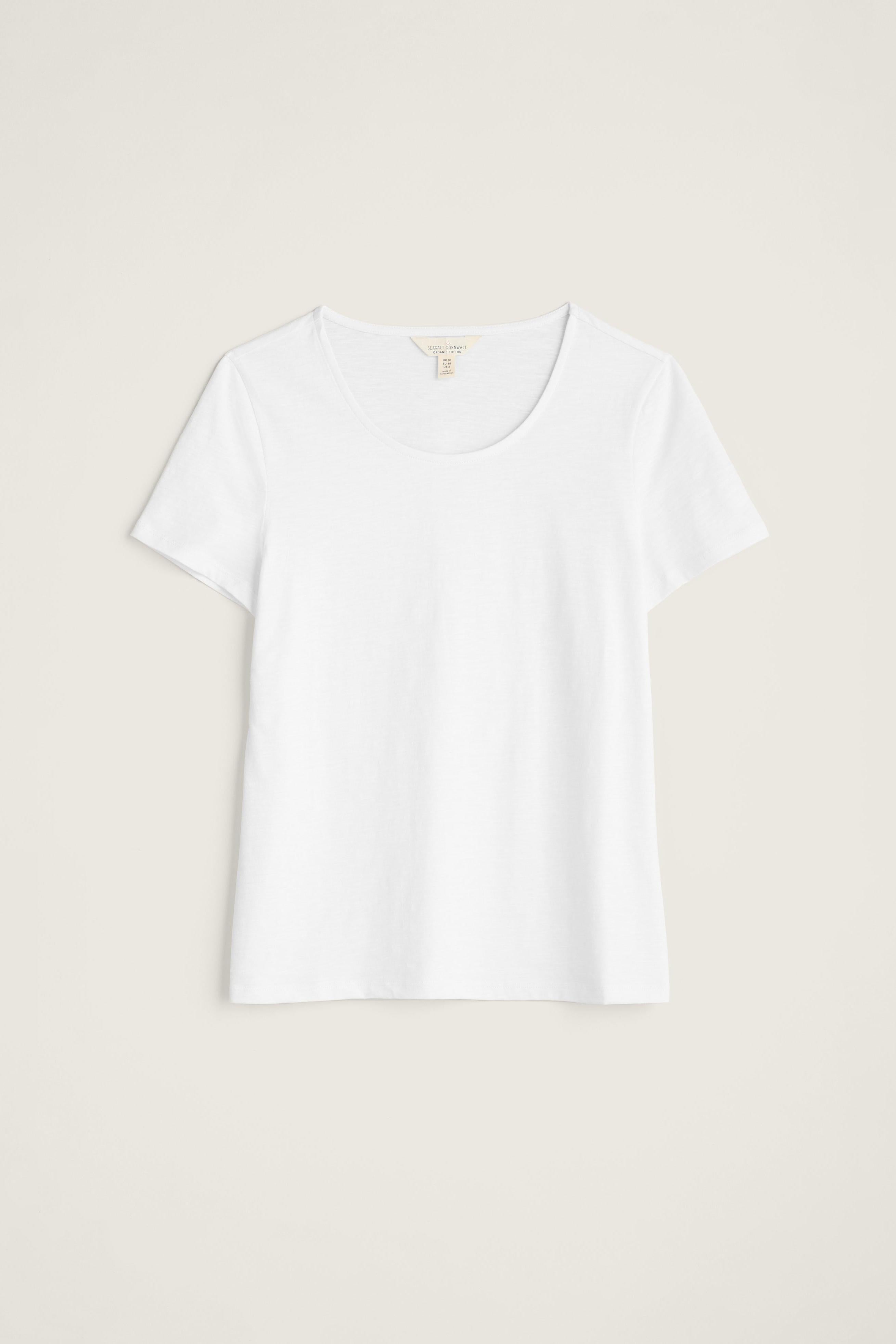 White organic cotton t-shirt on a light beige background