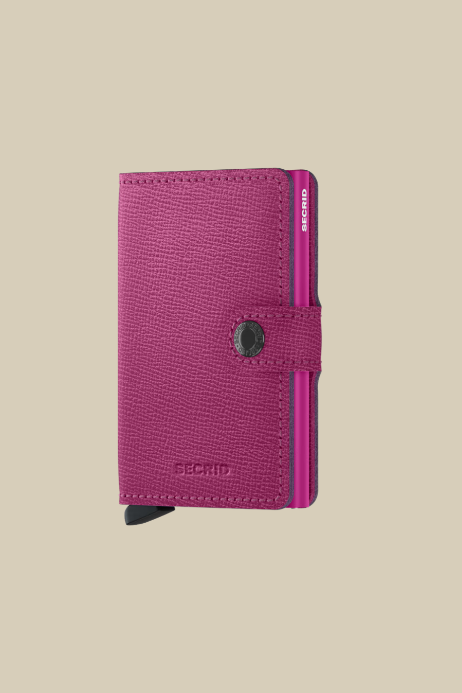 Purple wallet with a visible Secrid brand logo on a beige background