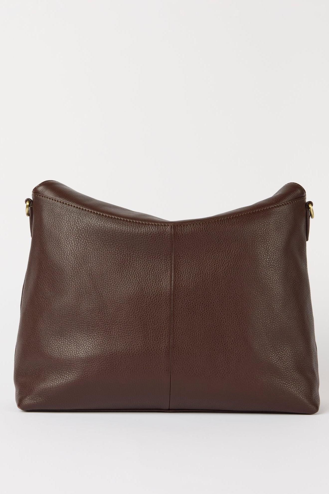 Brown leather handbag on a white background