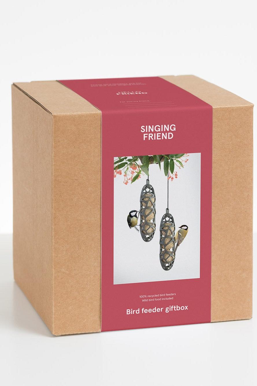 Bird feeder giftbox with 'Singing Friend' branding on a white background