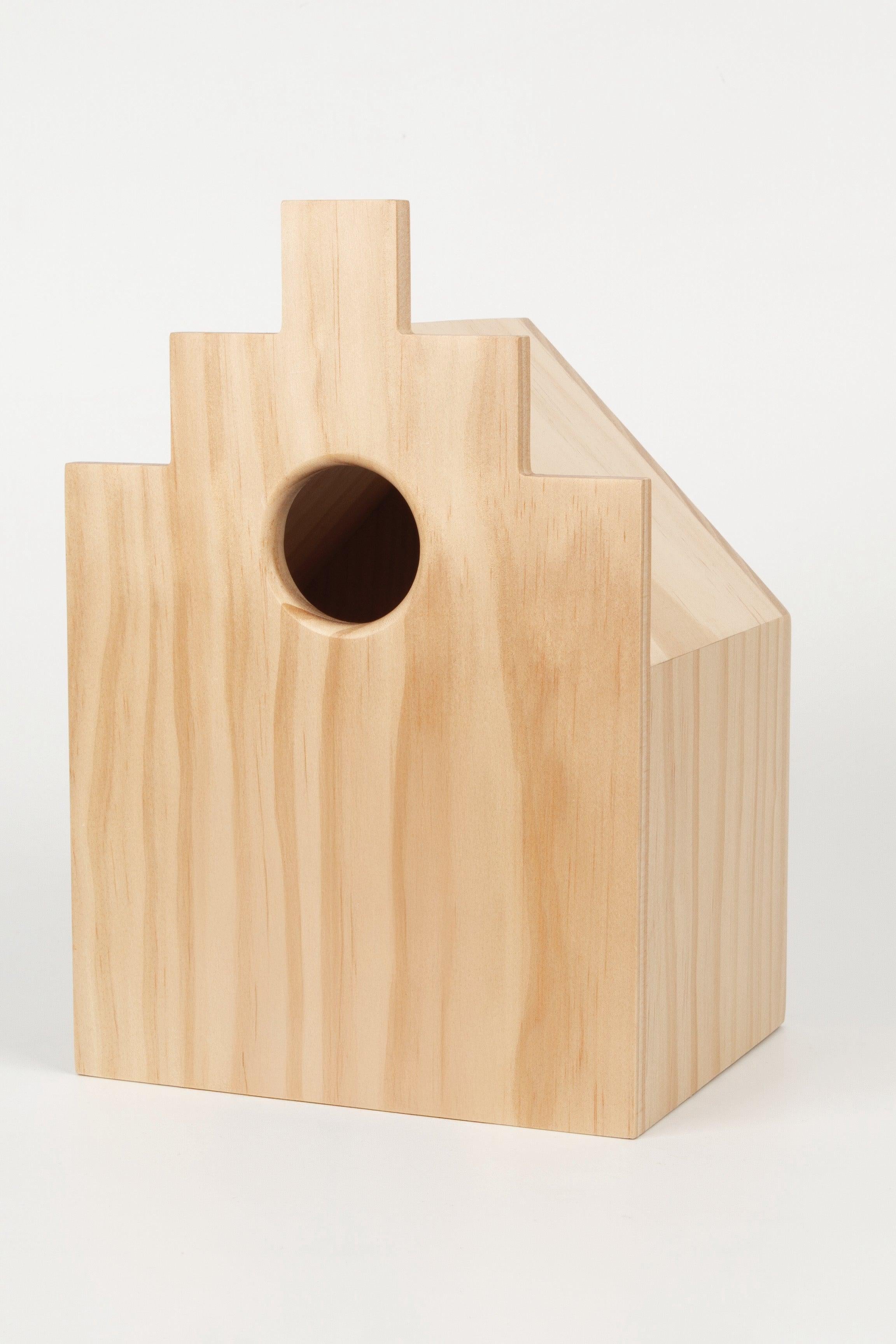 Wooden birdhouse on a white background