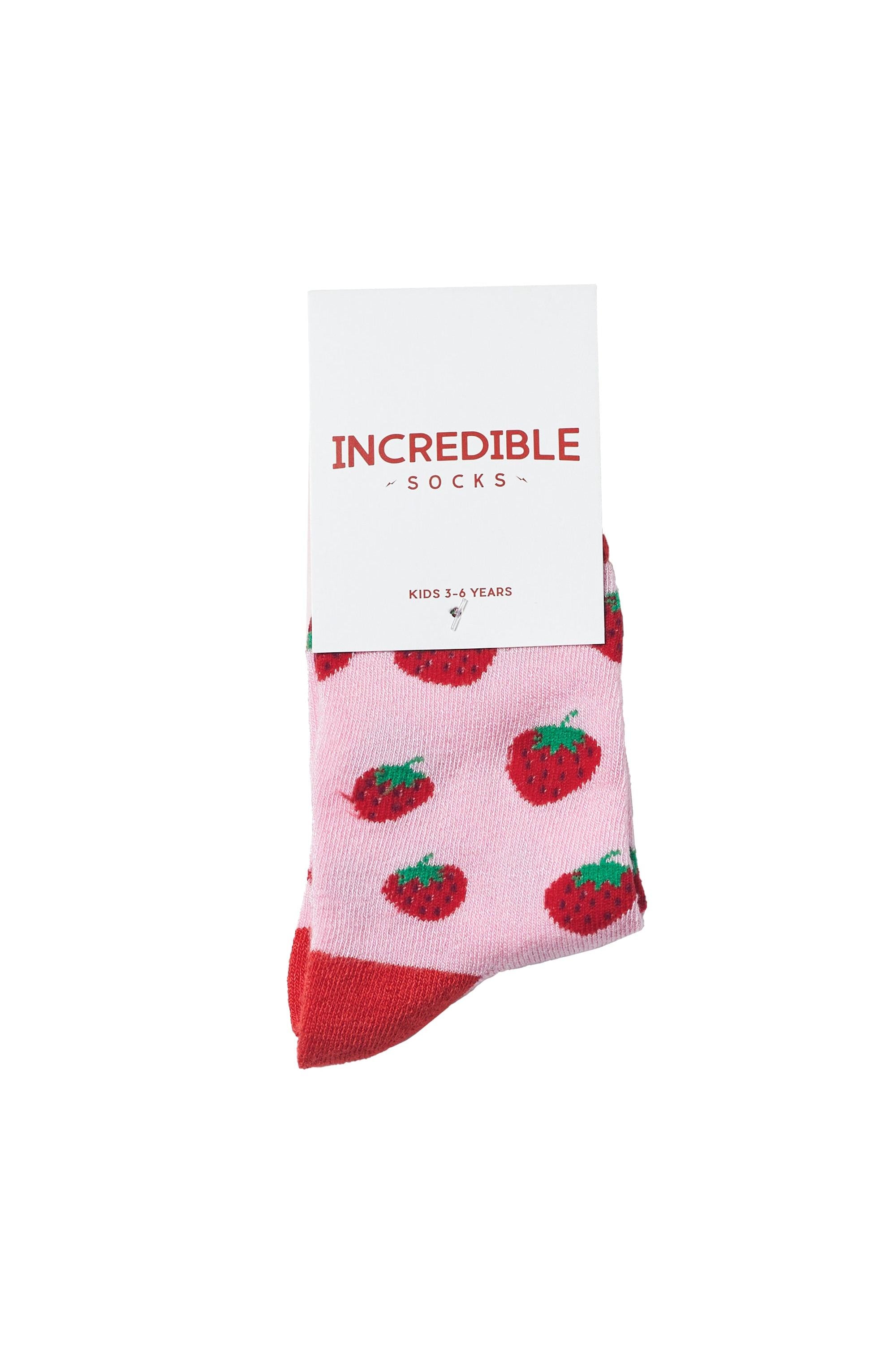 Pink socks with strawberry pattern on a white background