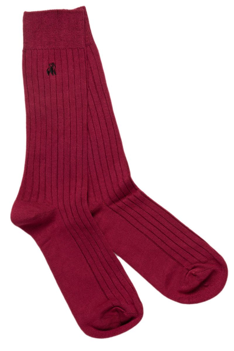 A pair of burgundy coloured men's bamboo dress socks with a stitched detail of a panda on the side