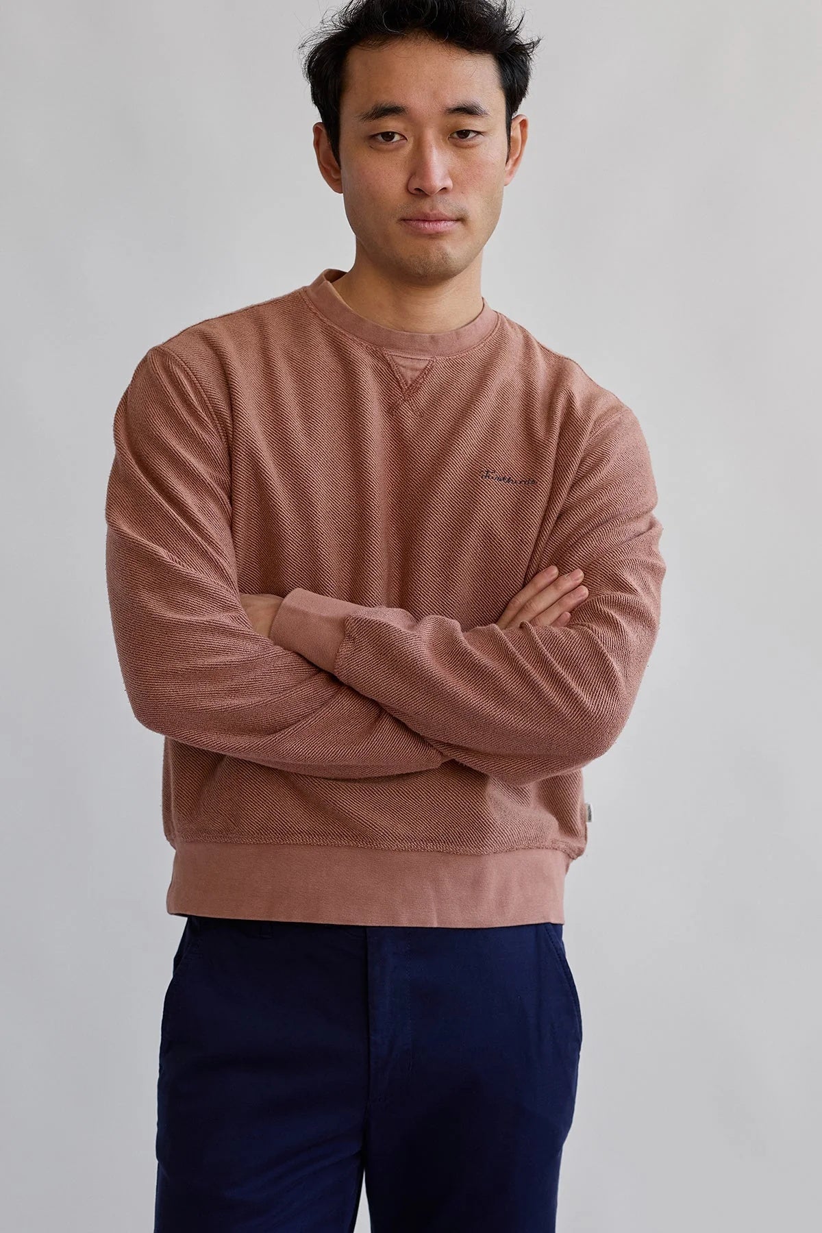 Front view of male model wearing TWOTHIRDS Fatu Hiva Sweatshirt in Coconut Shell colour, featuring a crewneck design with 'Twothirds' embroidery on the chest.