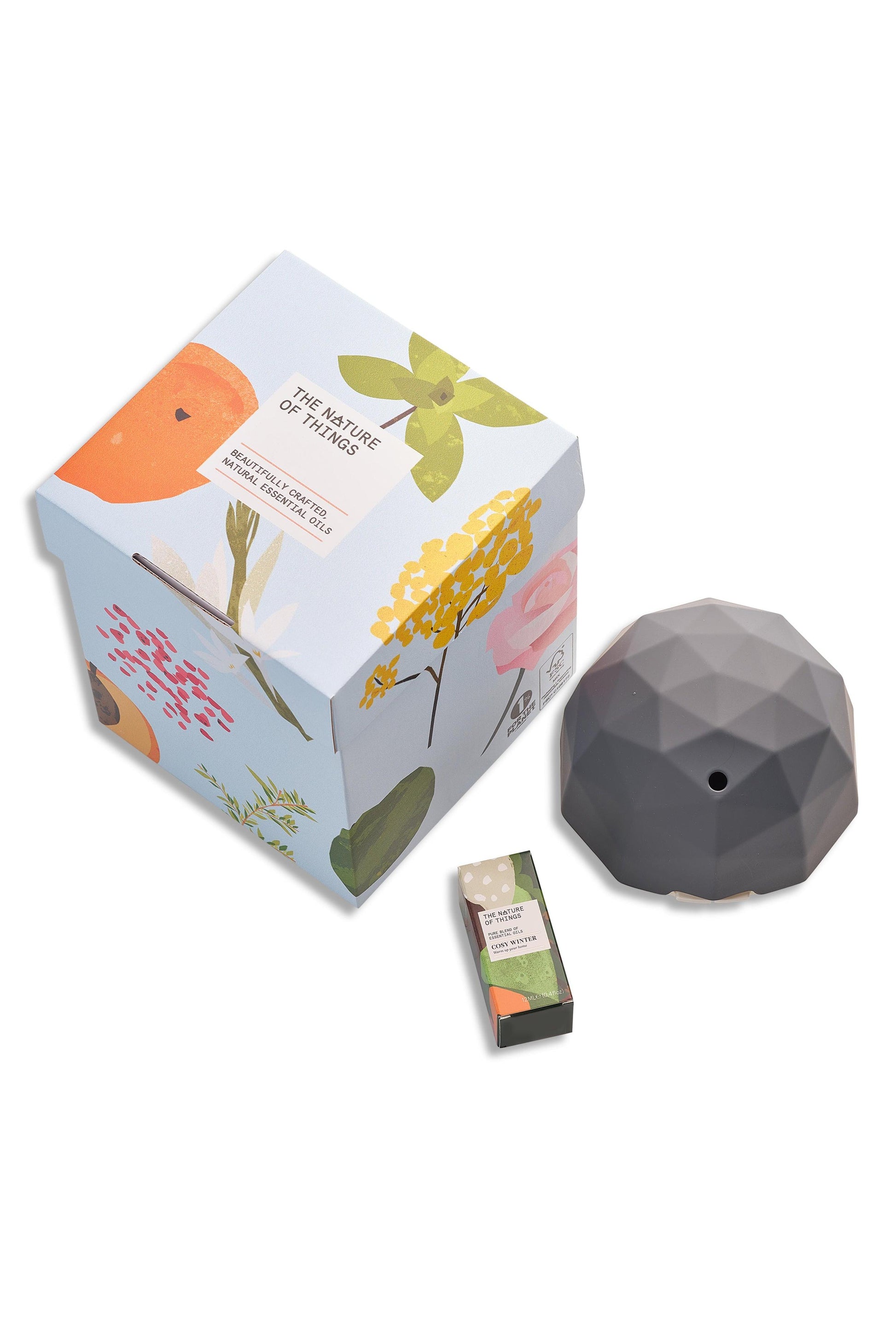Geometric diffuser with packaging and small box on a white background