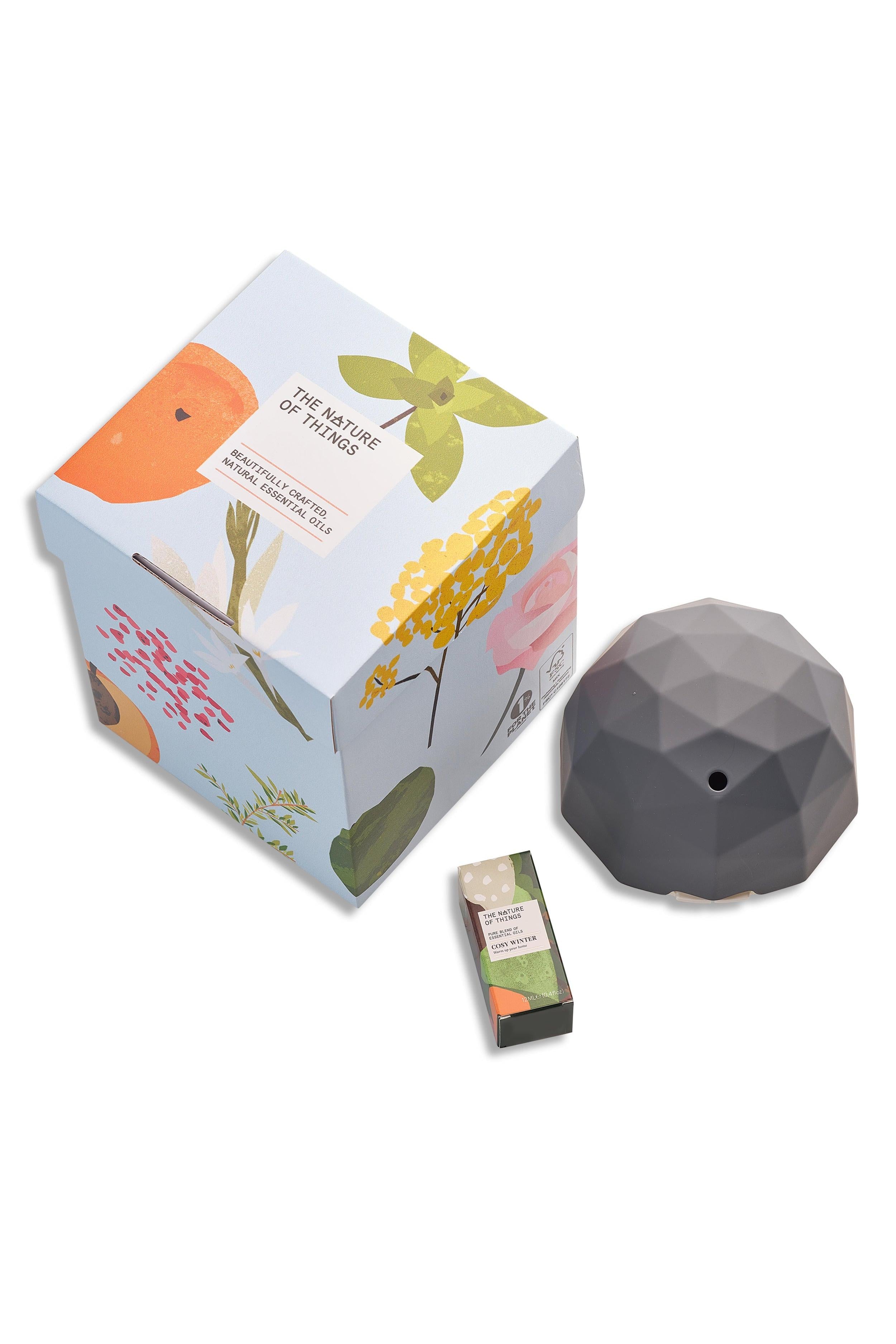 Geometric diffuser with packaging and small box on a white background