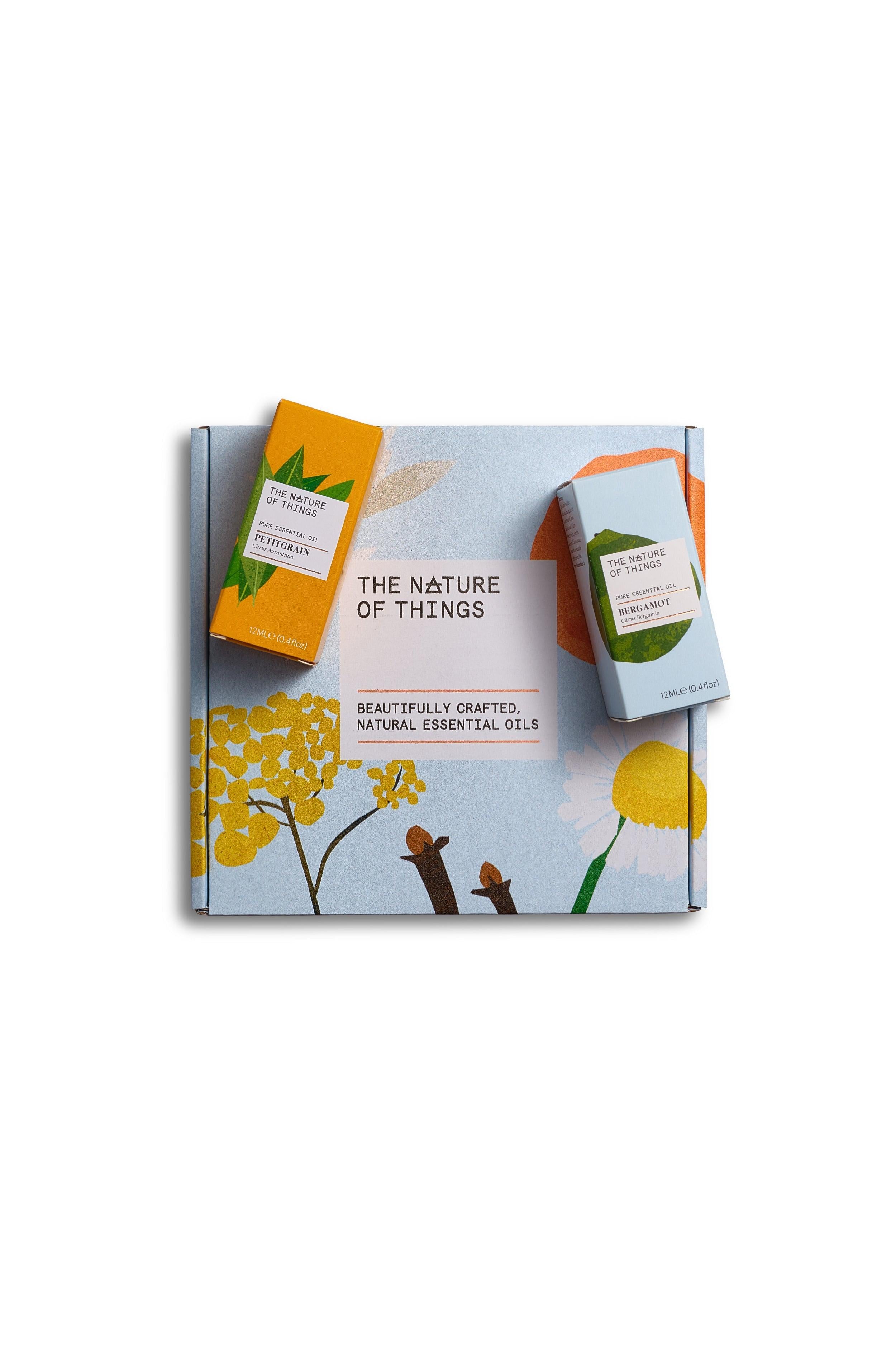 Packaging of 'The Nature of Things' natural essential oils with a white background