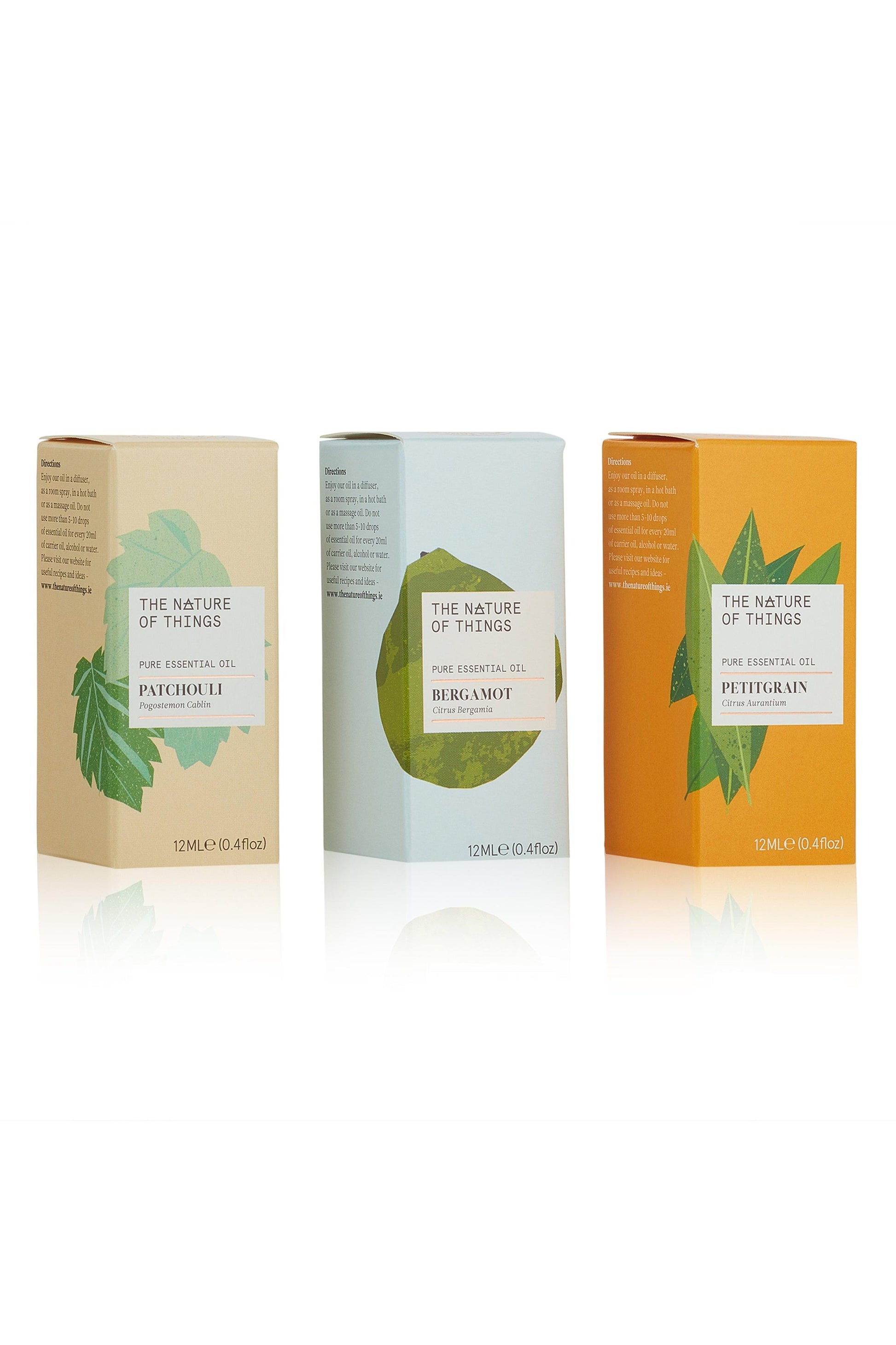 Three boxes of 'The Nature of Things' essential oils on a white background