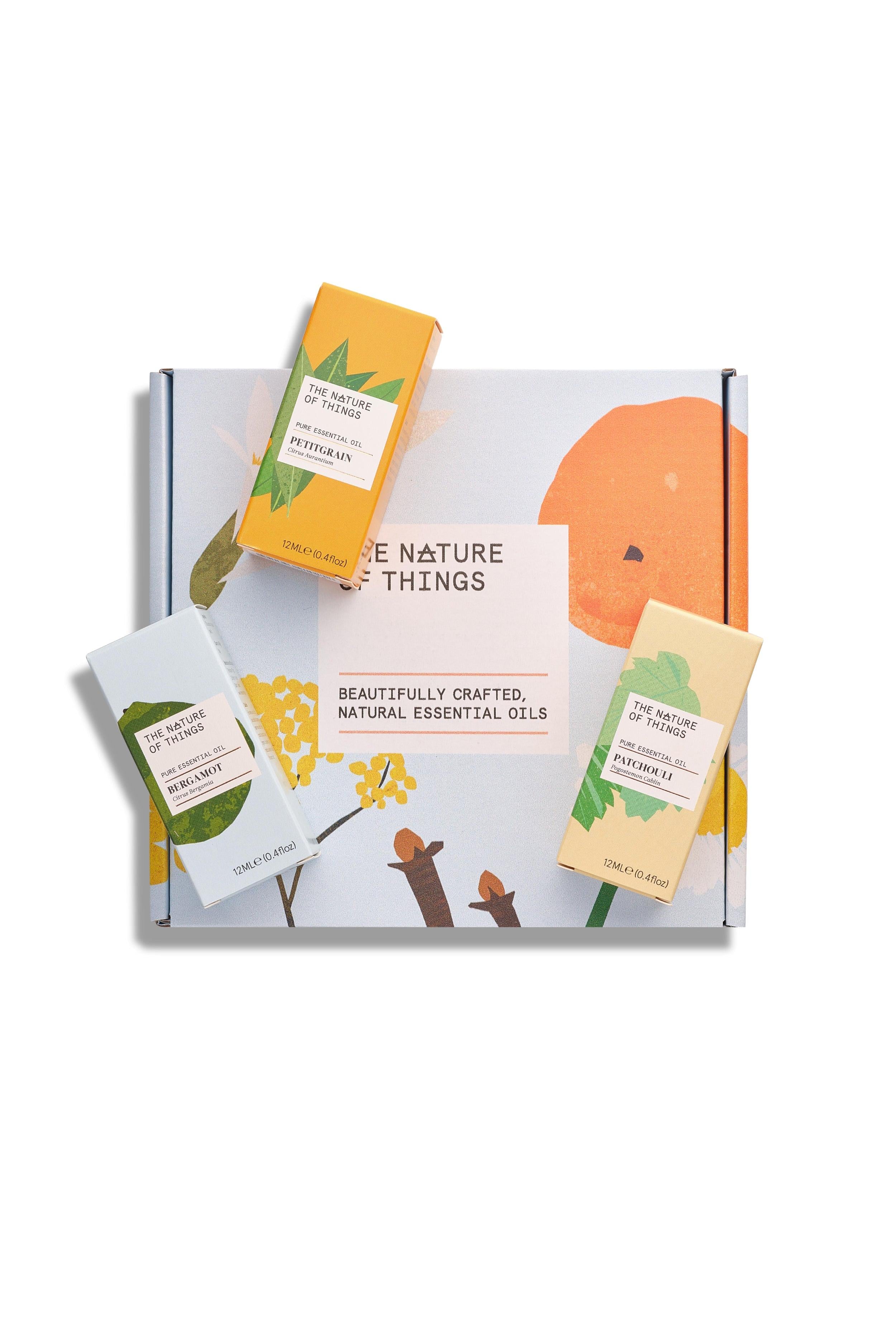 Set of natural essential oils with packaging on a white background