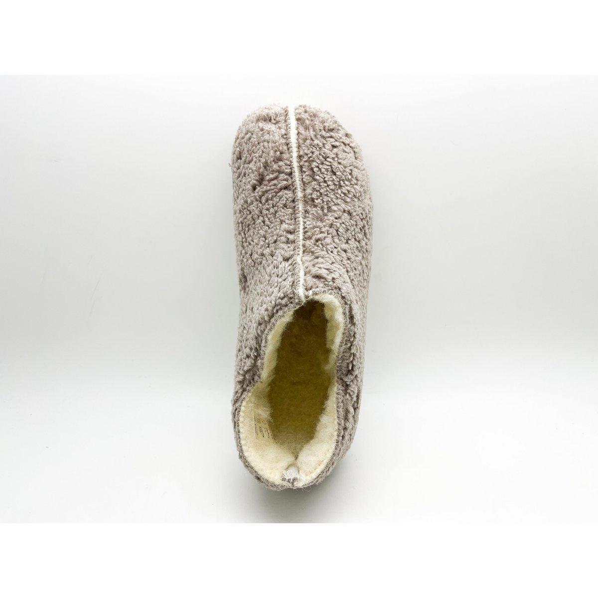 Single brown slipper with white interior on a light gray background