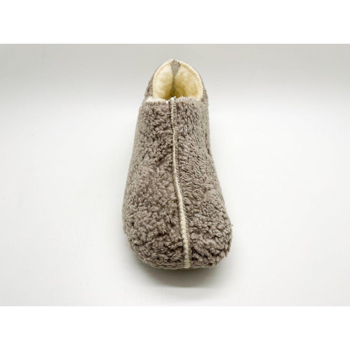 Brown fuzzy slippers on a white background