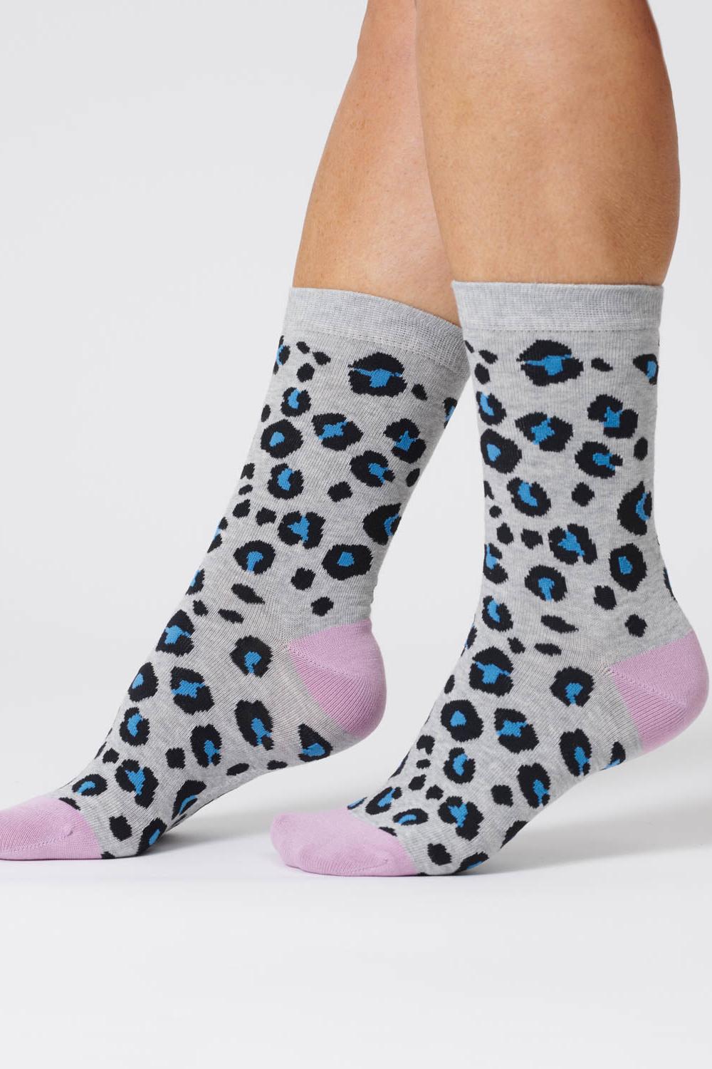 Mid-grey marl bamboo socks with blue animal print spots and lilac heels and toes.