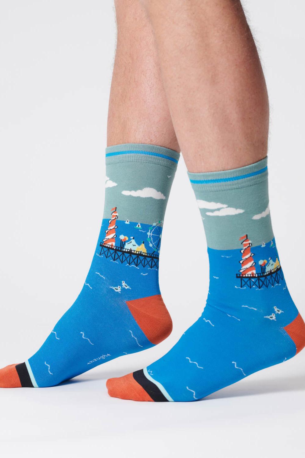 Lagoon green organic cotton socks with a waterfront scene design in shades of blue