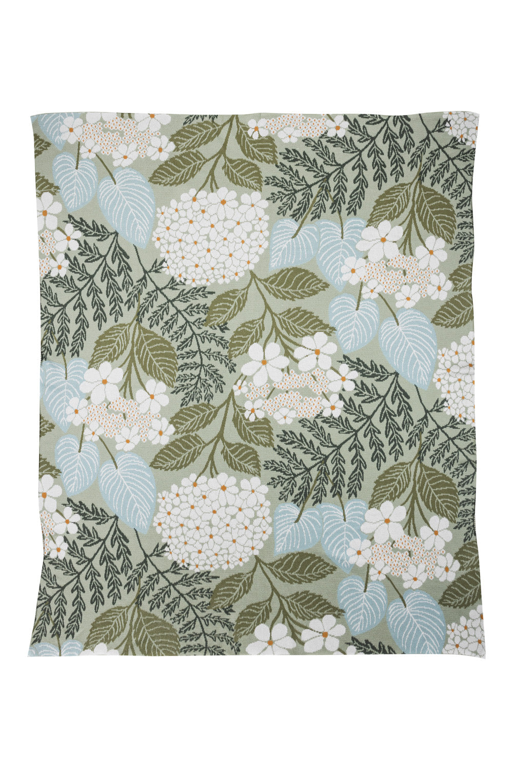Floral pattern blanket with green leaves and white flowers on a light background