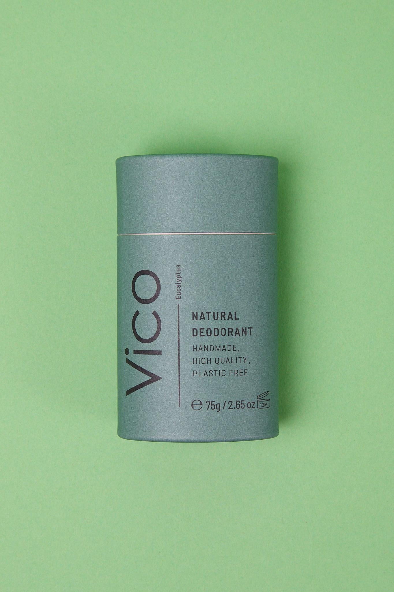 Vico Eucalyptus Natural Deodorant laid flat on green background.