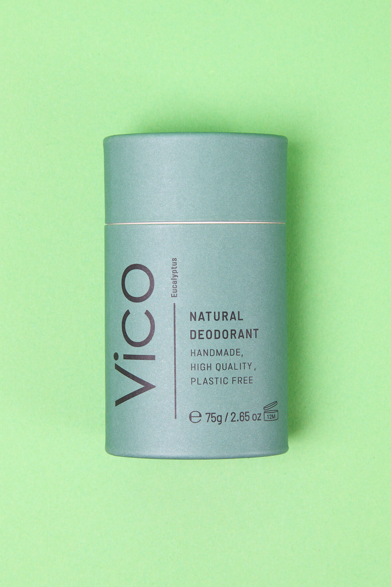 Vico Eucalyptus Natural Deodorant laid flat on green background.