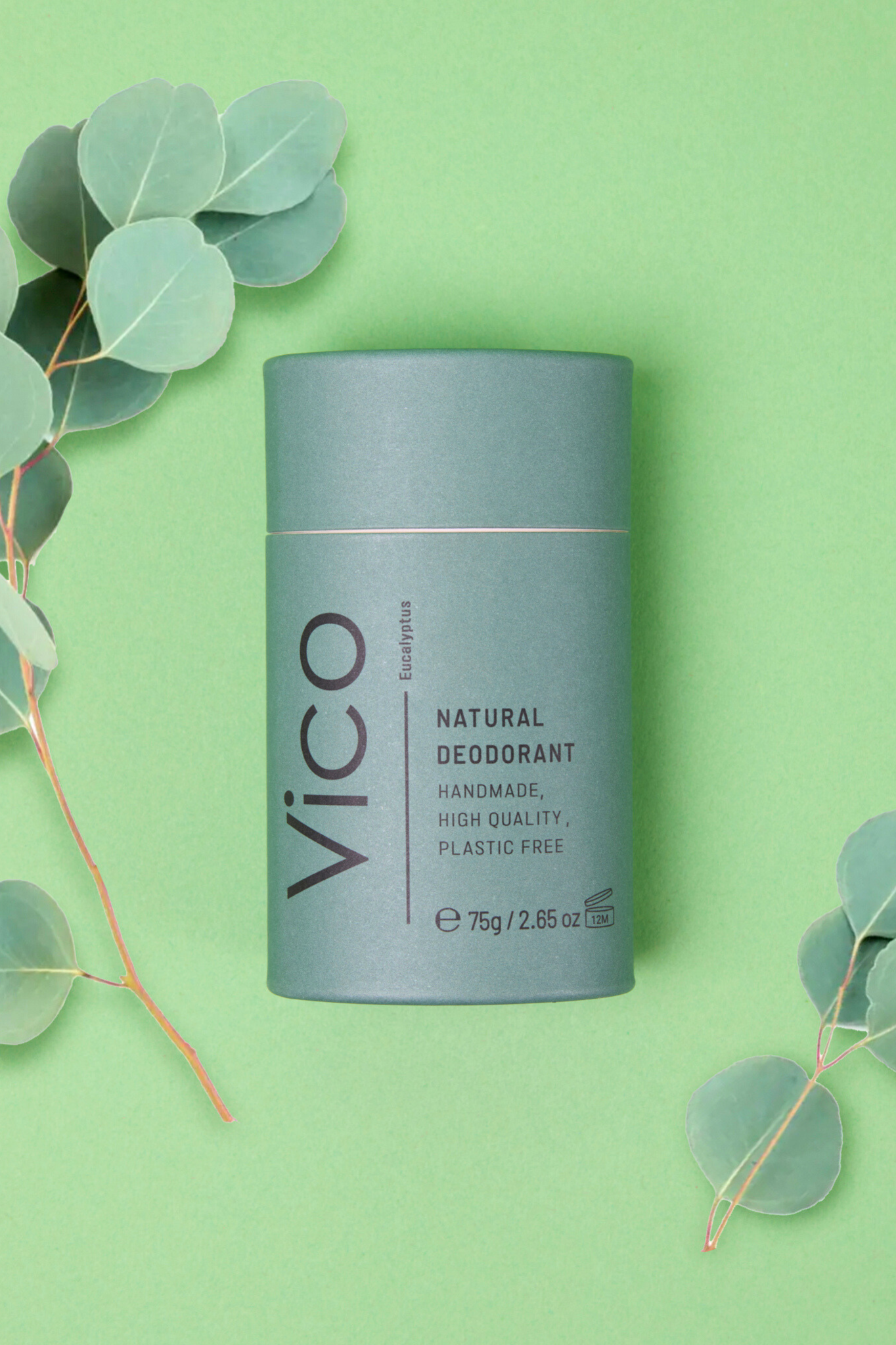 Vico Eucalyptus Natural Deodorant in green packaging with eucalyptus around it on green background.