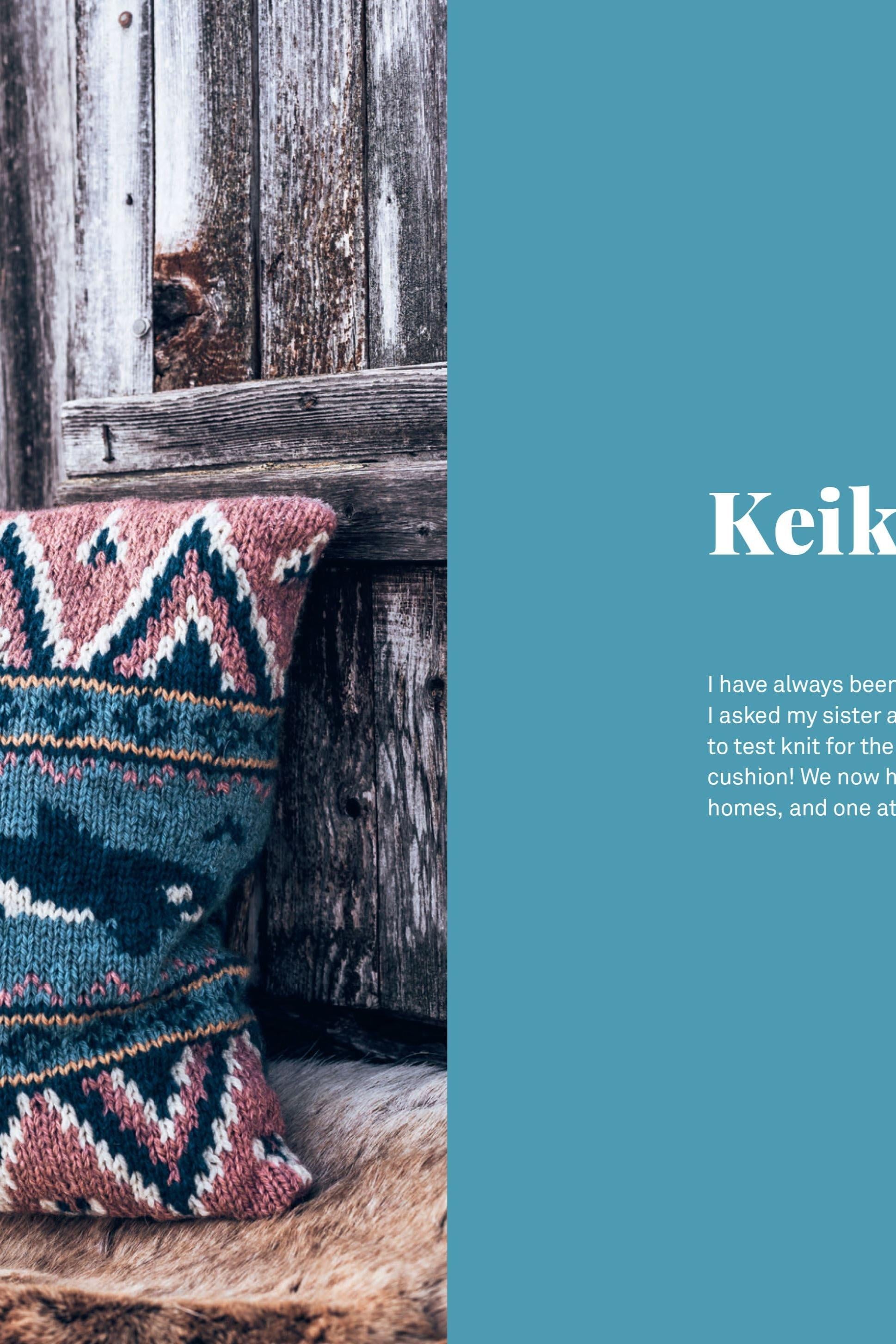 Knitted patterned cushion on a wooden surface with a rustic background
