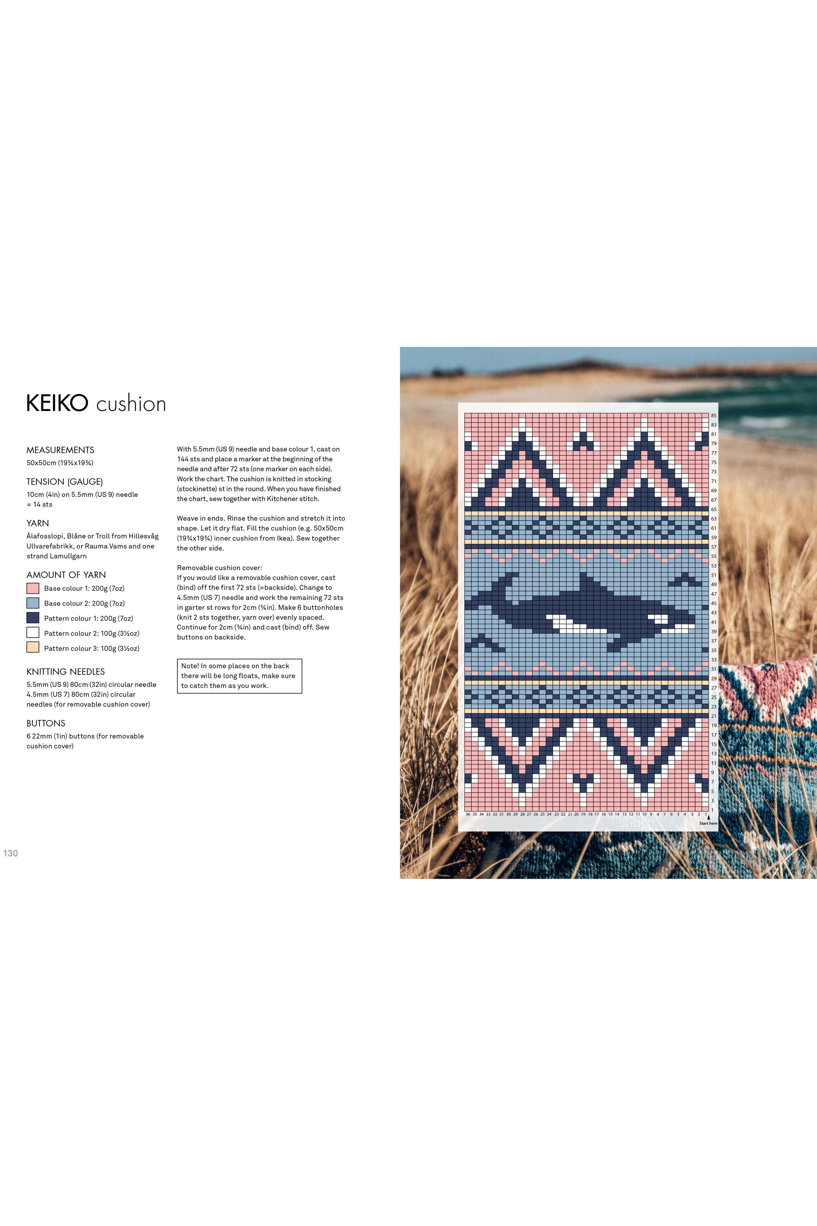 Knitted cushion with whale design on a grassy field background