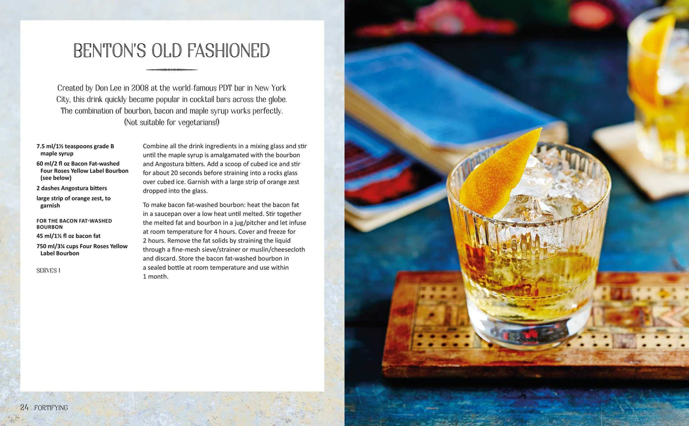 Old Fashioned cocktail with a lemon twist on a wooden coaster, accompanied by a recipe card.
