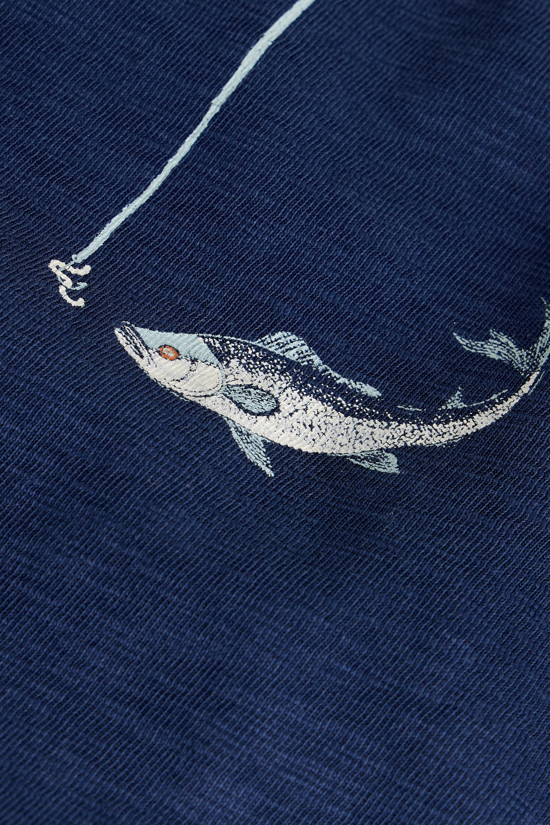Embroidered fish design on a navy blue t-shirt