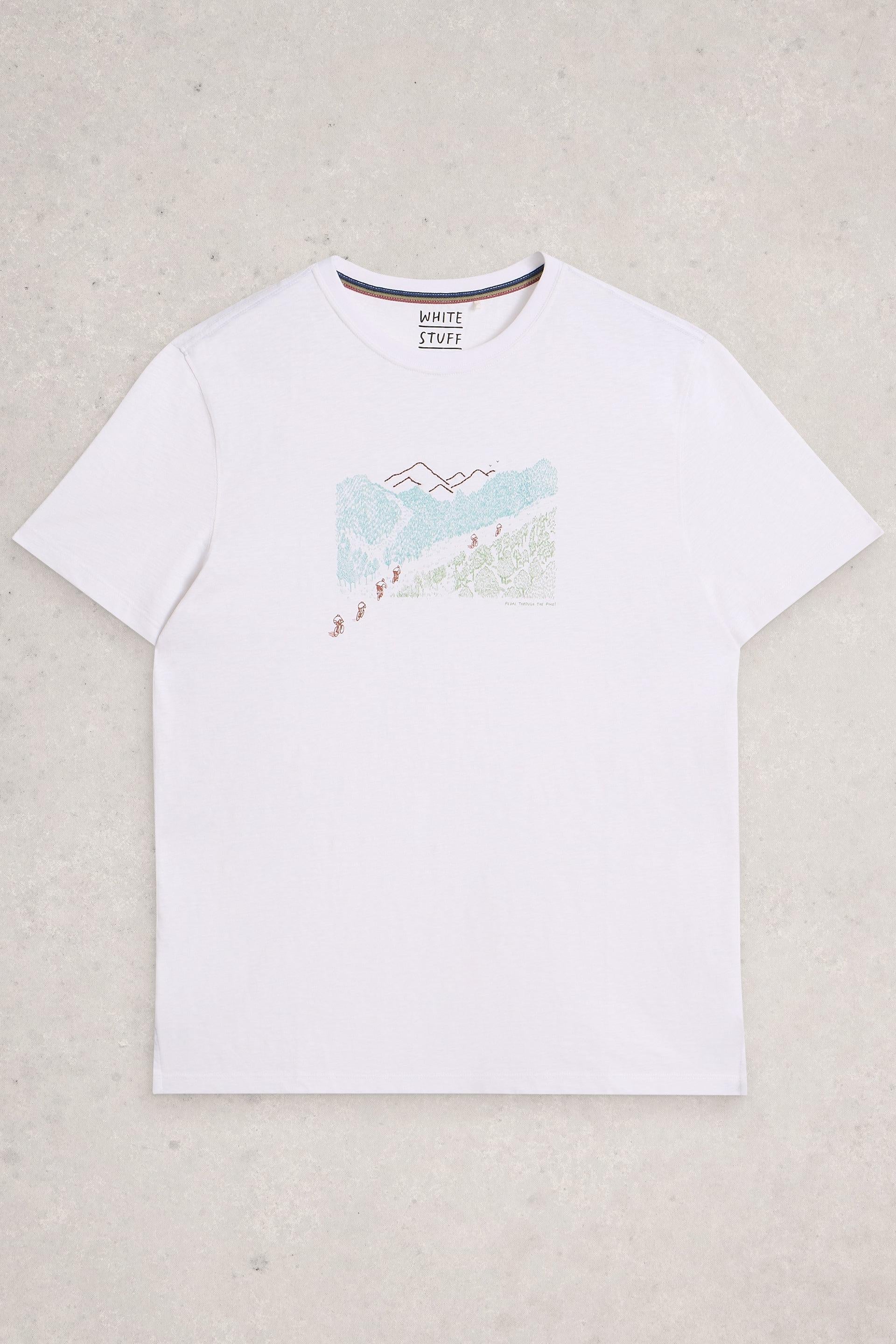 White t-shirt with a mountain design on a light gray background