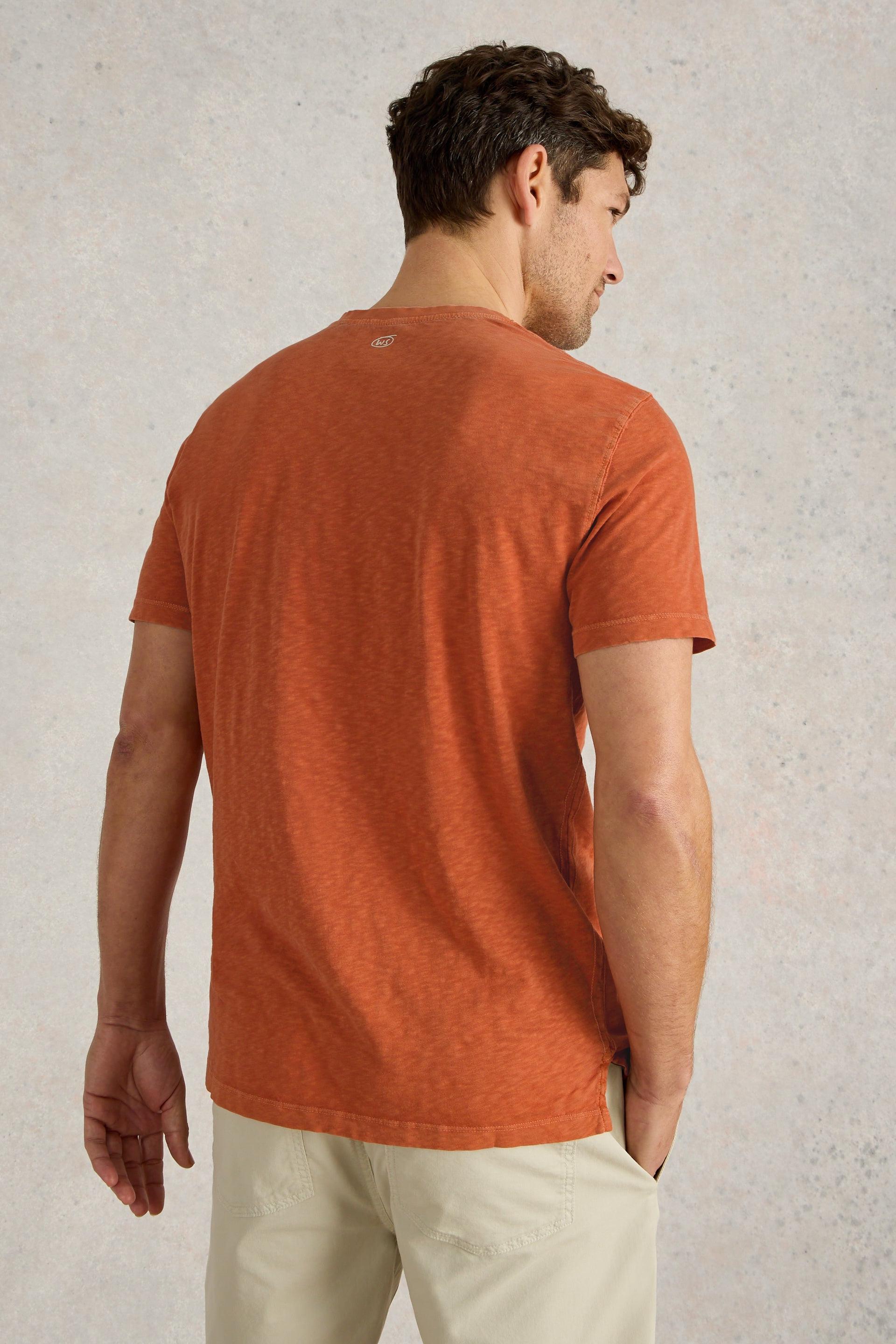 Back view of orange t-shirt showing a classic fit.