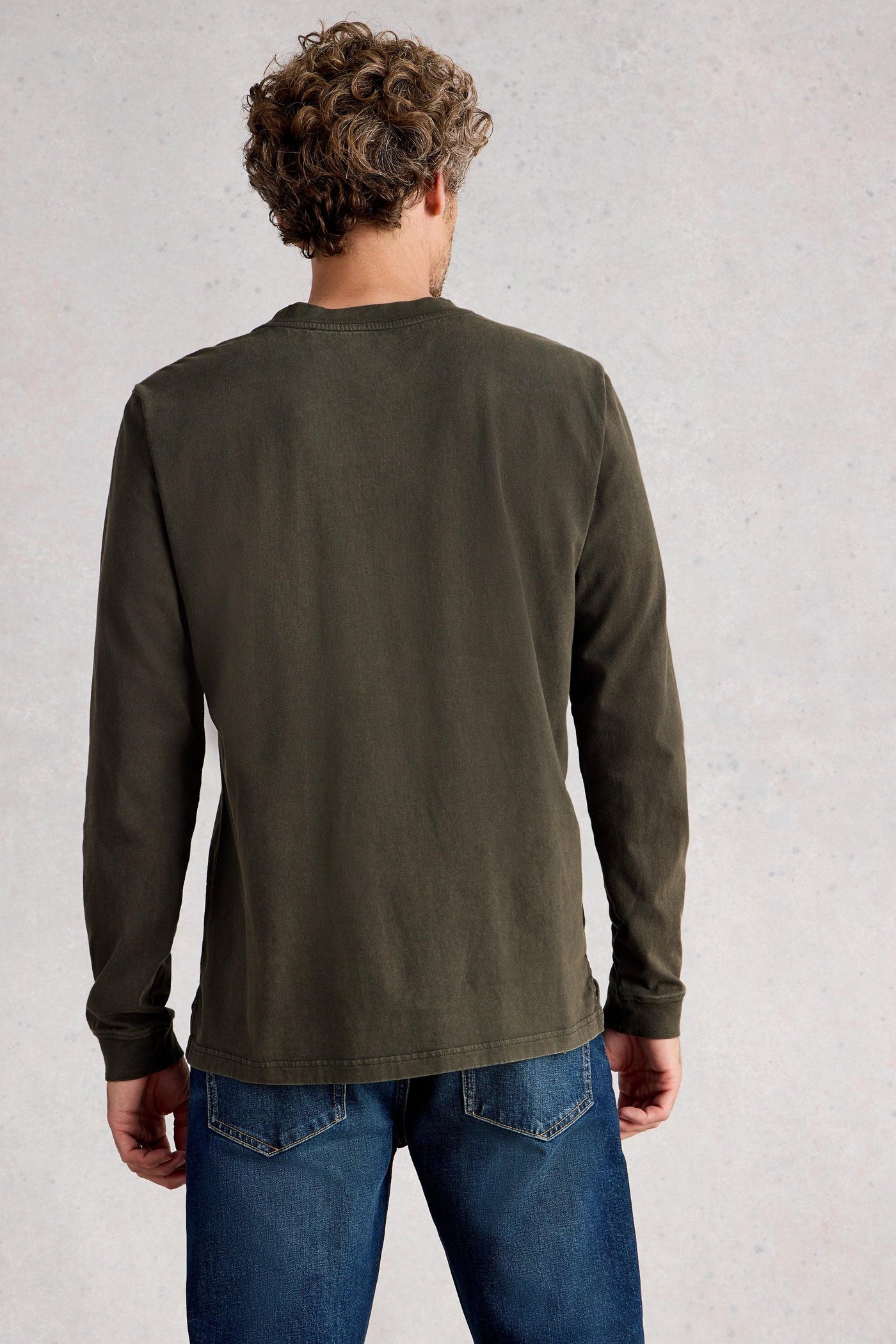 Back view of long sleeve green organic cotton t-shirt showing regular length