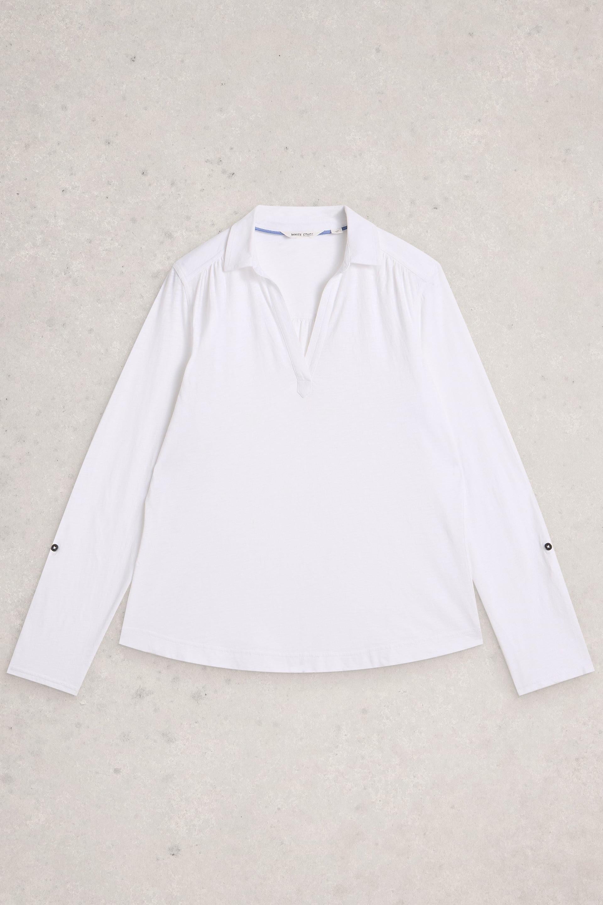 White shirt on a textured beige background