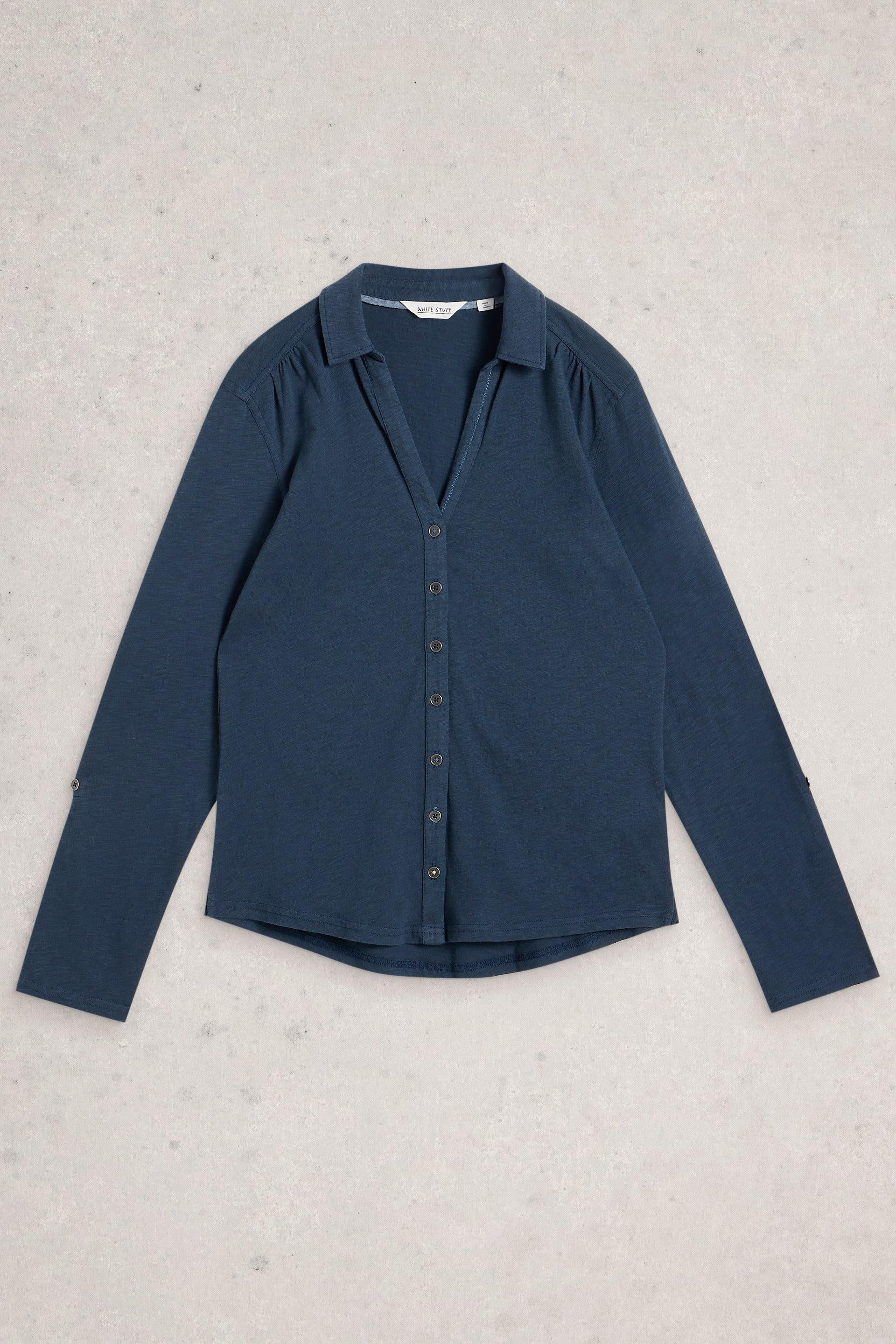 Blue cotton shirt on a light gray background