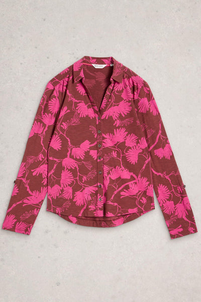 Button up cotton shirt in pink floral print, laid flat on neutral background