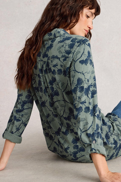 Back of green Annie longline tunic with blue floral print, 100% cotton, showing long sleeves and classic fit, worn by model.