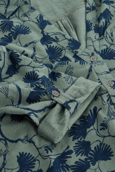 Close up of button detail on sleeve of longline cotton tunic