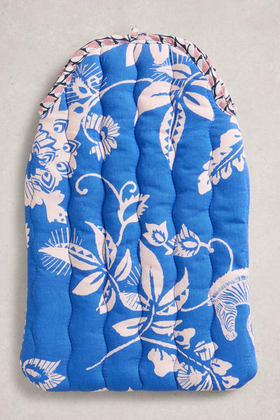 Blue floral-patterned hot water bottle on a light gray background