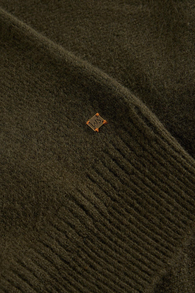 Close up of small White Stuff logo and ribbed cuffs on wool cardigan