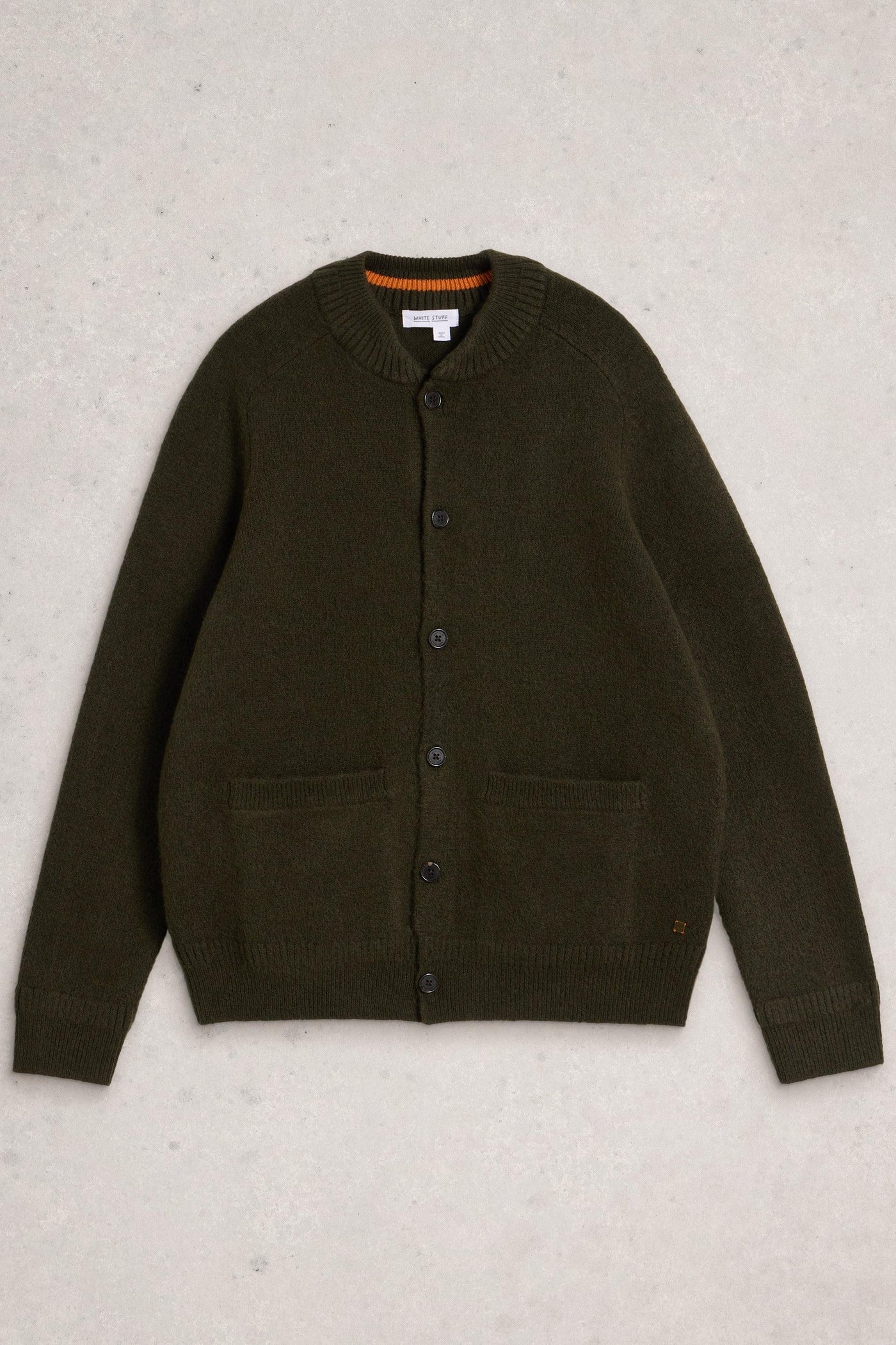Flat lay of green wool cardigan with button up closure