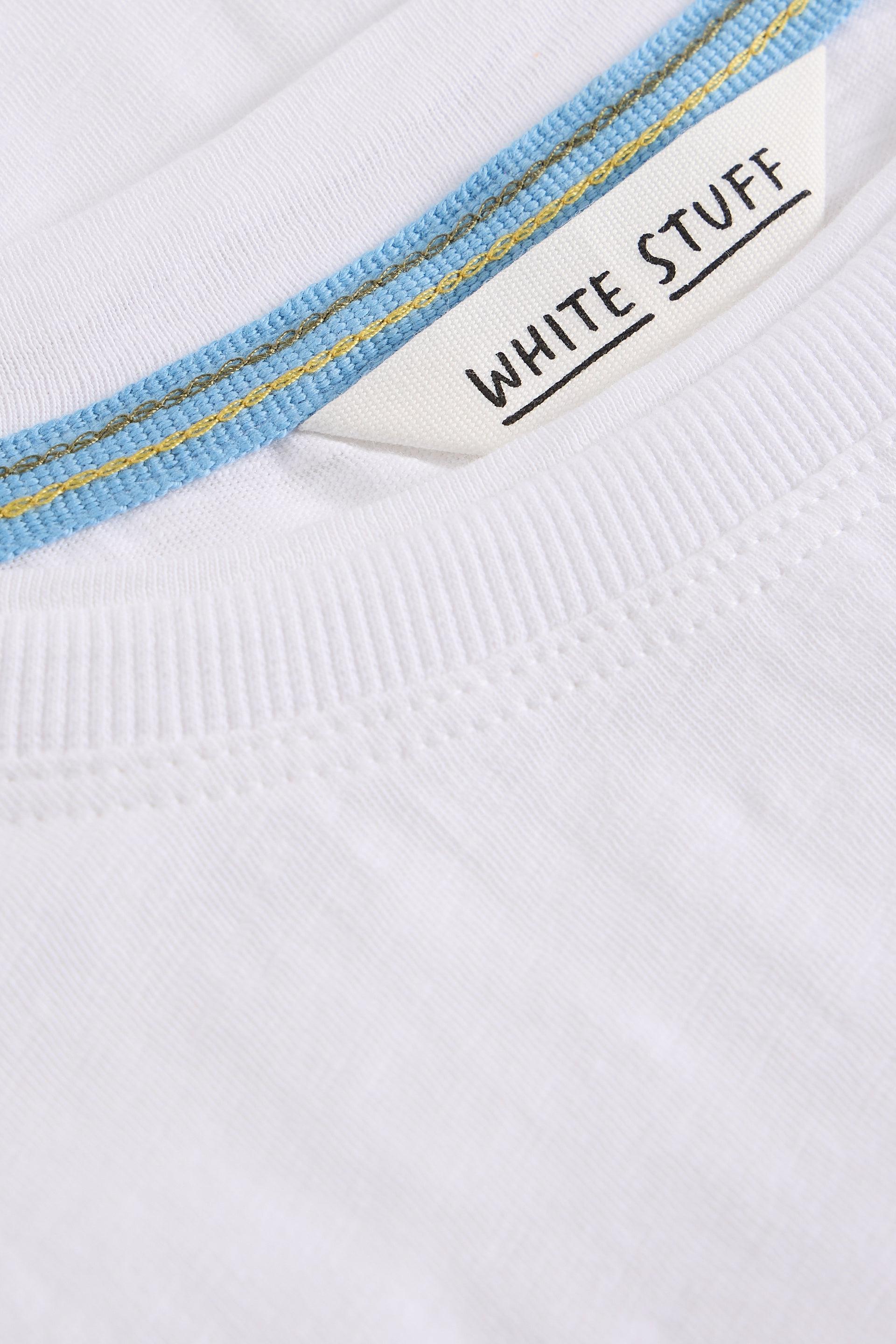 Close-up of a white t-shirt with 'White Stuff' label