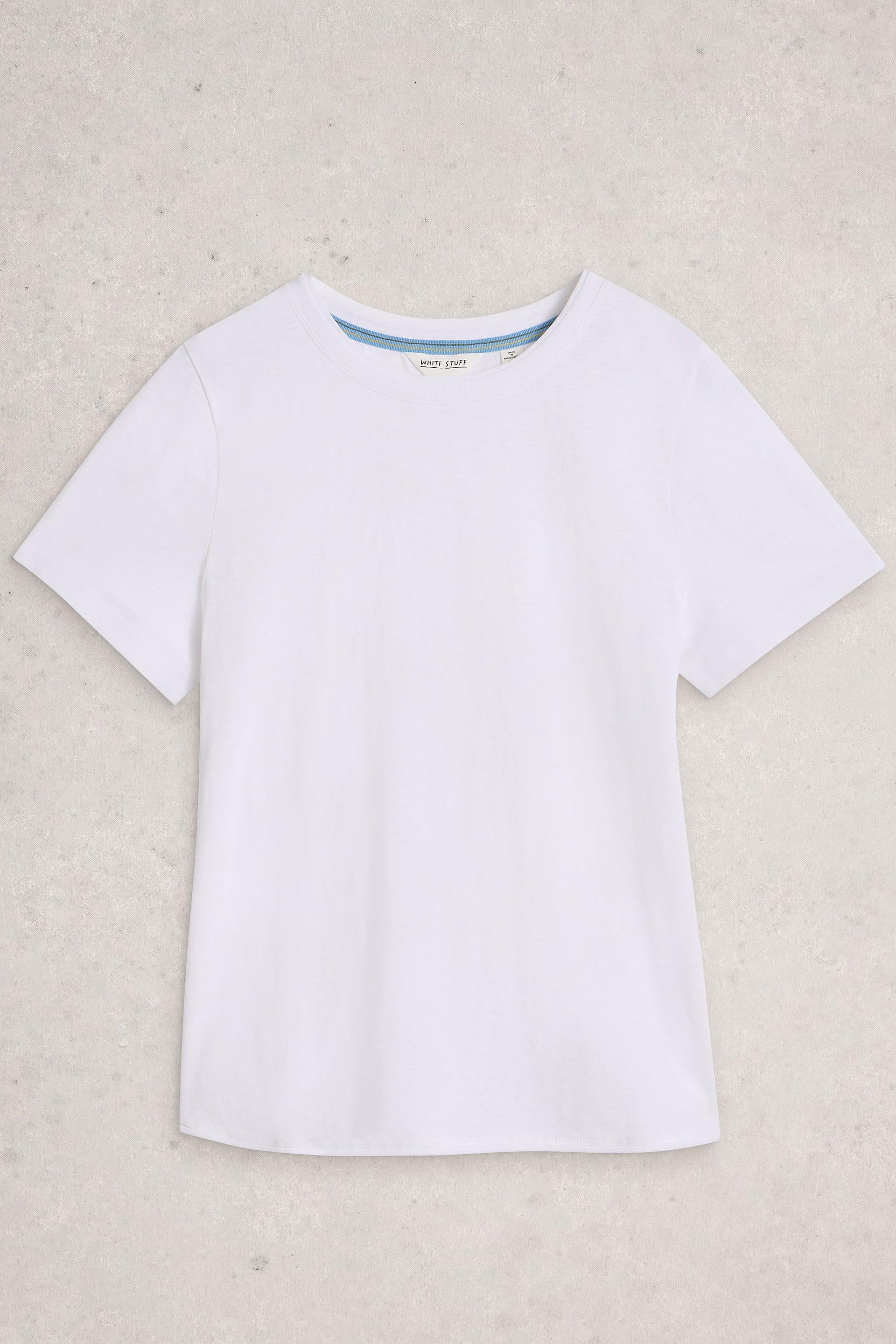 White cotton t-shirt on a beige background