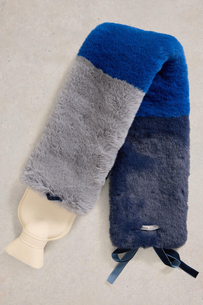 Multicolored fuzzy hat water bottle on a neutral background