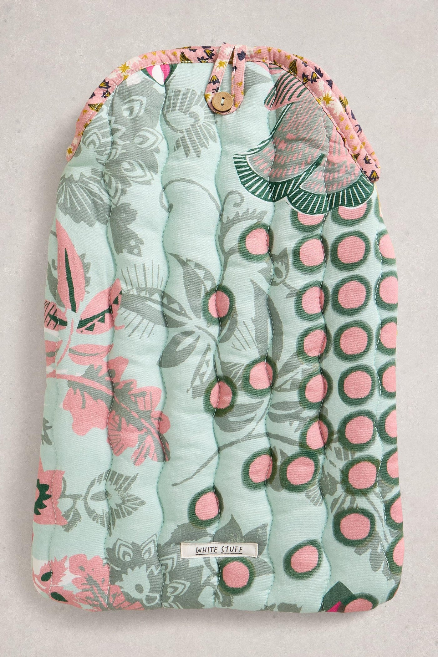 Floral and polka dot patterned product on a light background
